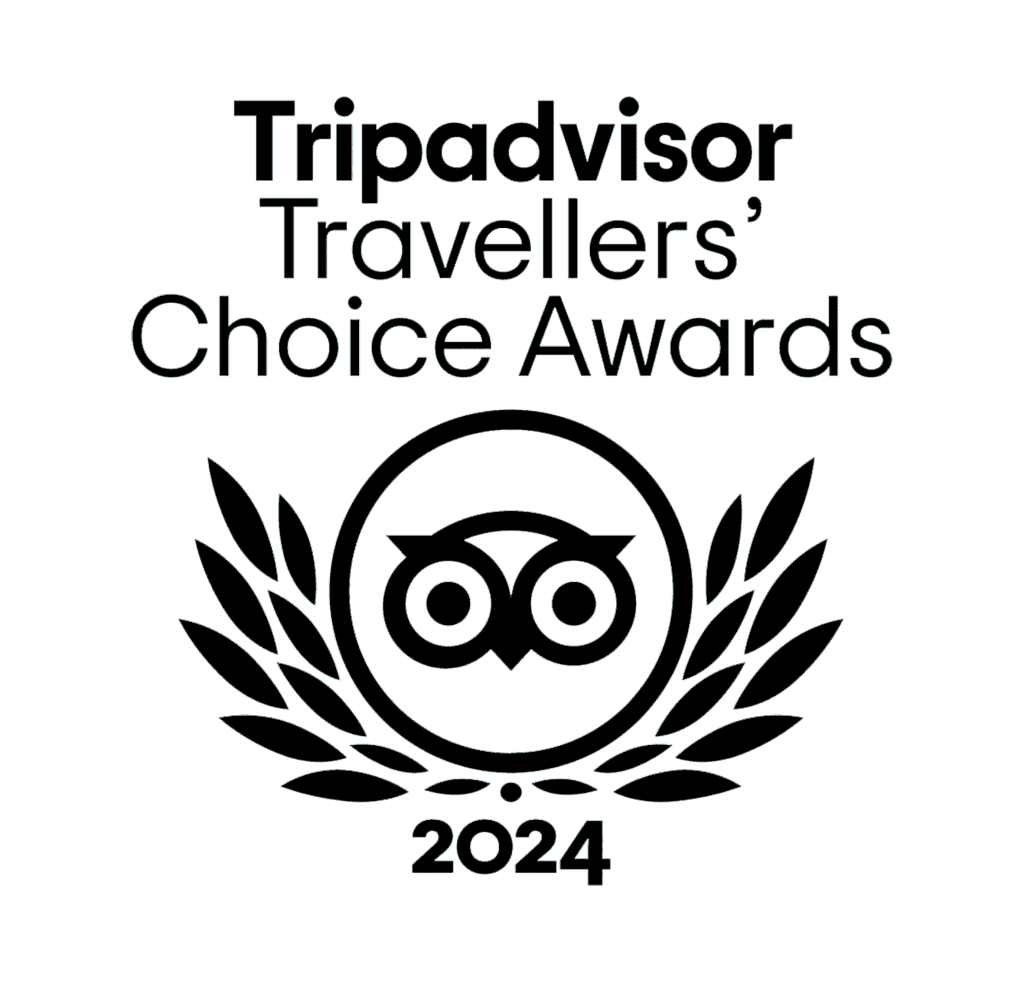 Tripadvisor Travellers' Choice Awards 2024 logo featuring an owl and laurel wreath, emphasizing Carpe Diem Tours' recognition in wine tourism.